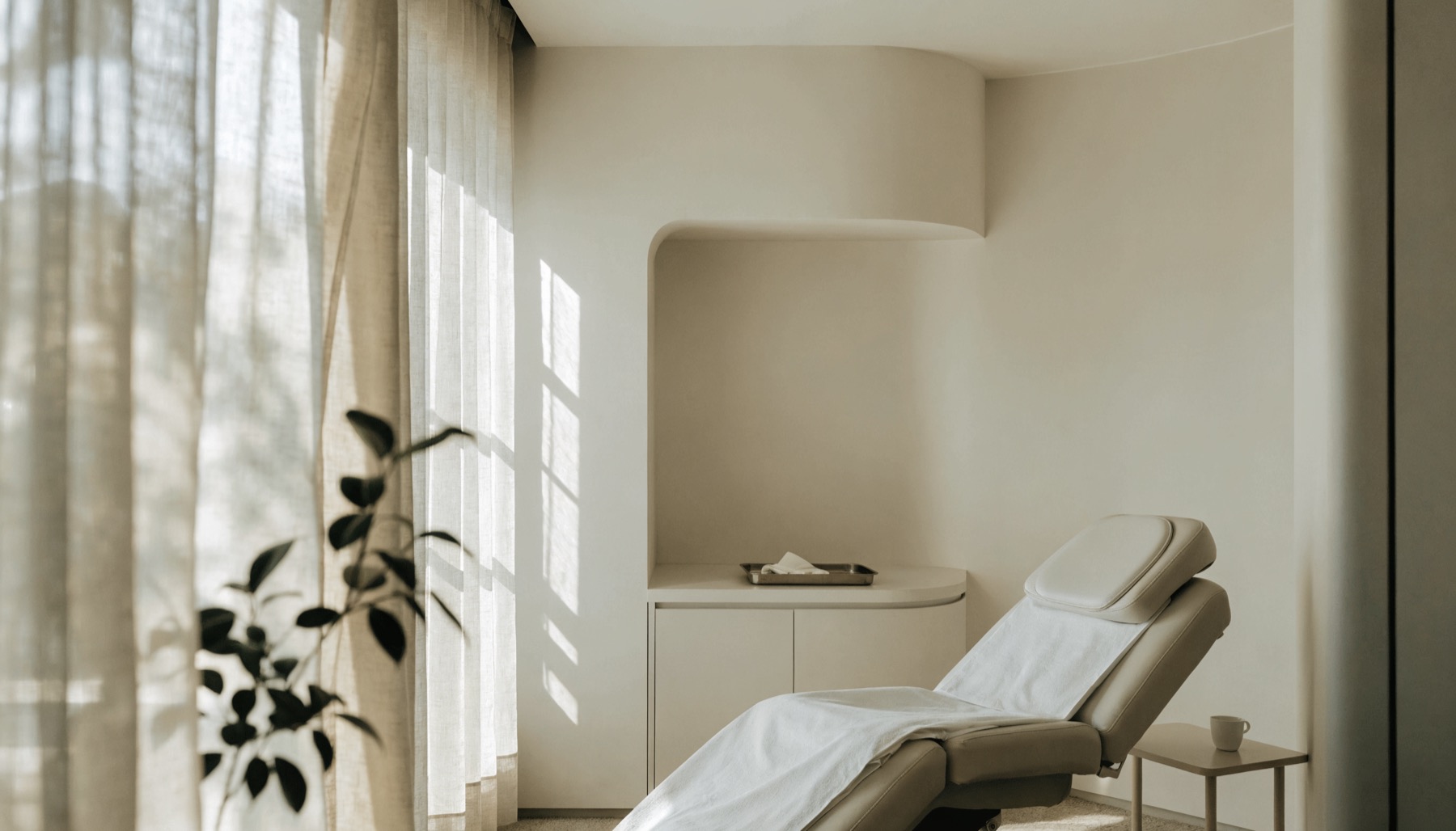 A calm treatment room with natural light